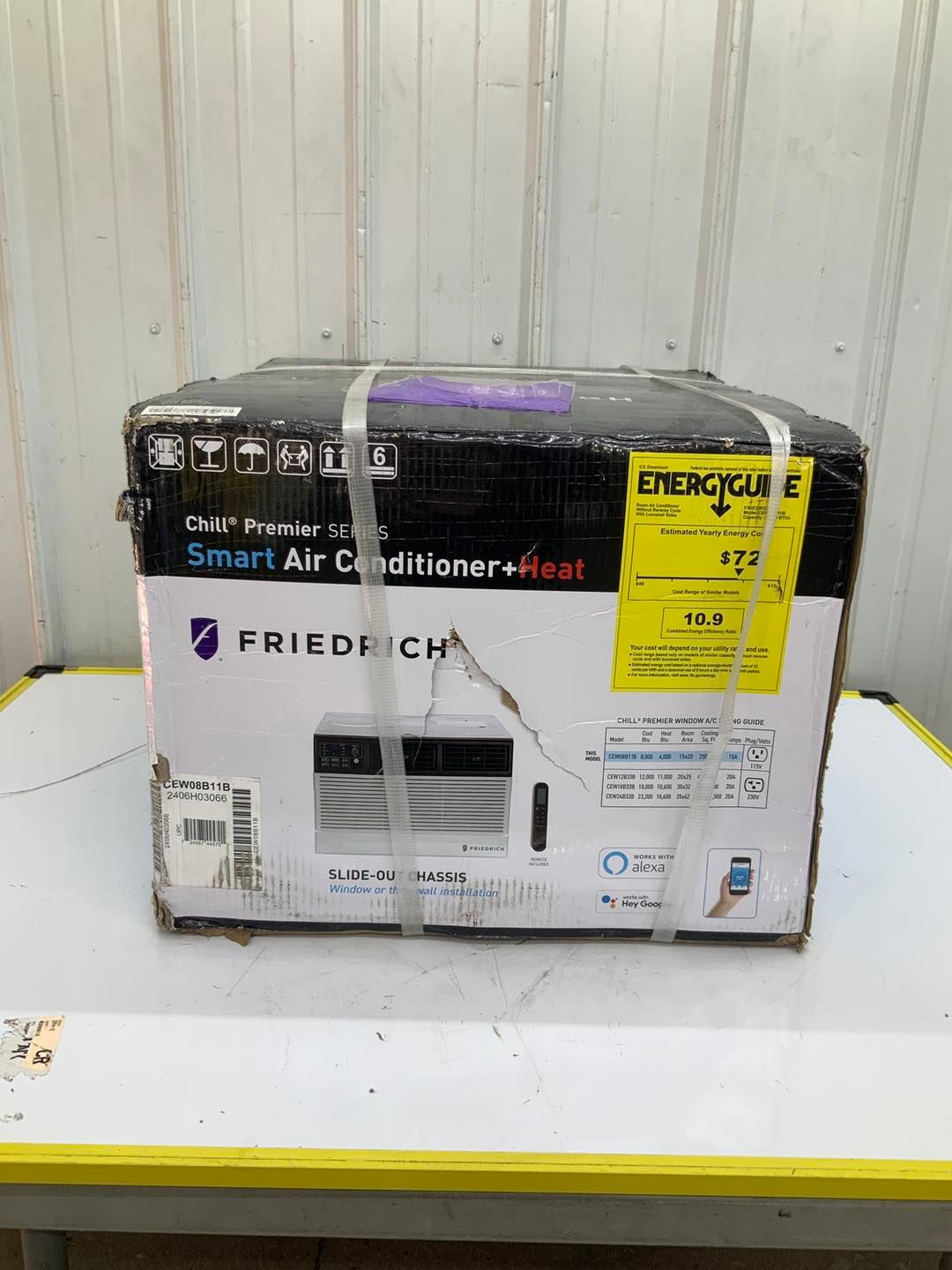 A box of friedrich smart air conditioner is sitting on a table.