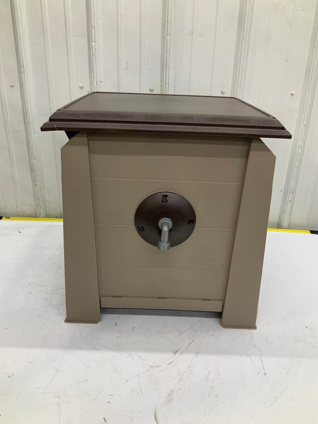A small wooden box with a lock on it is sitting on a table.