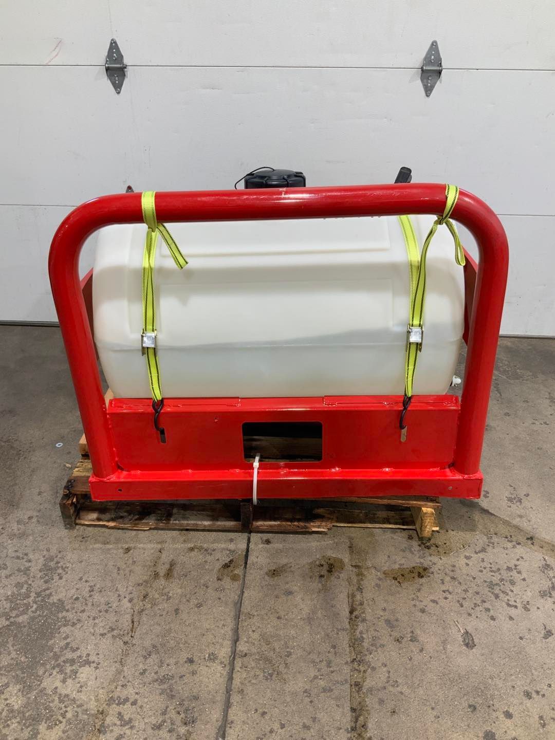 A red frame with a white tank attached to it