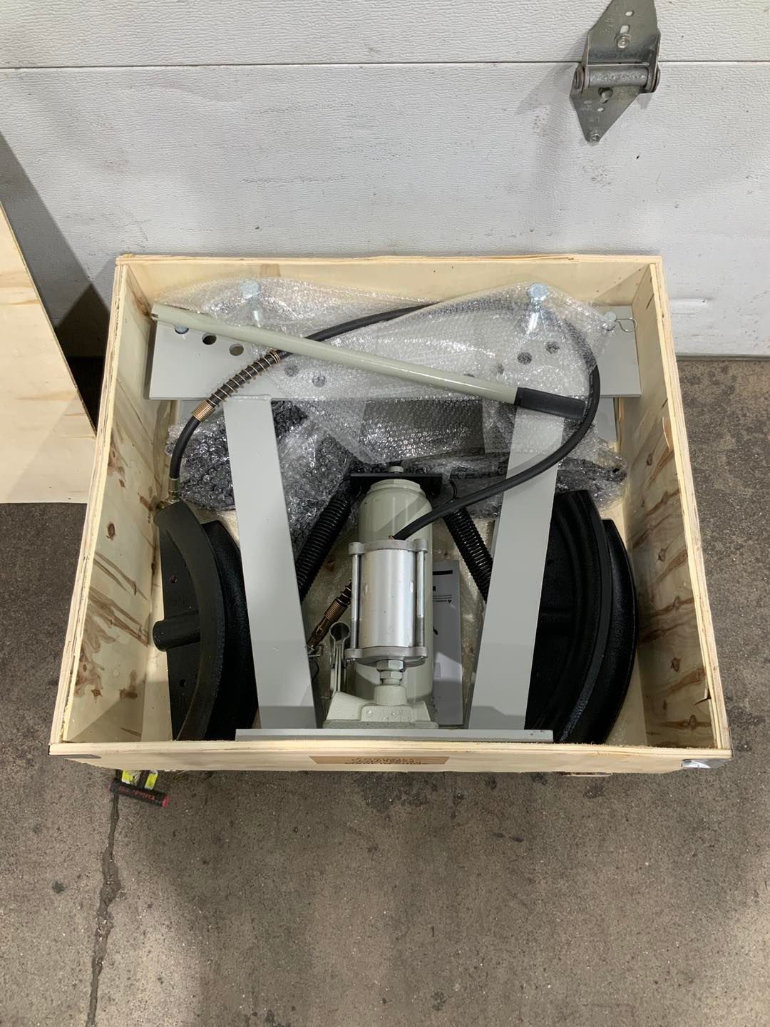 A machine is sitting in a wooden box.