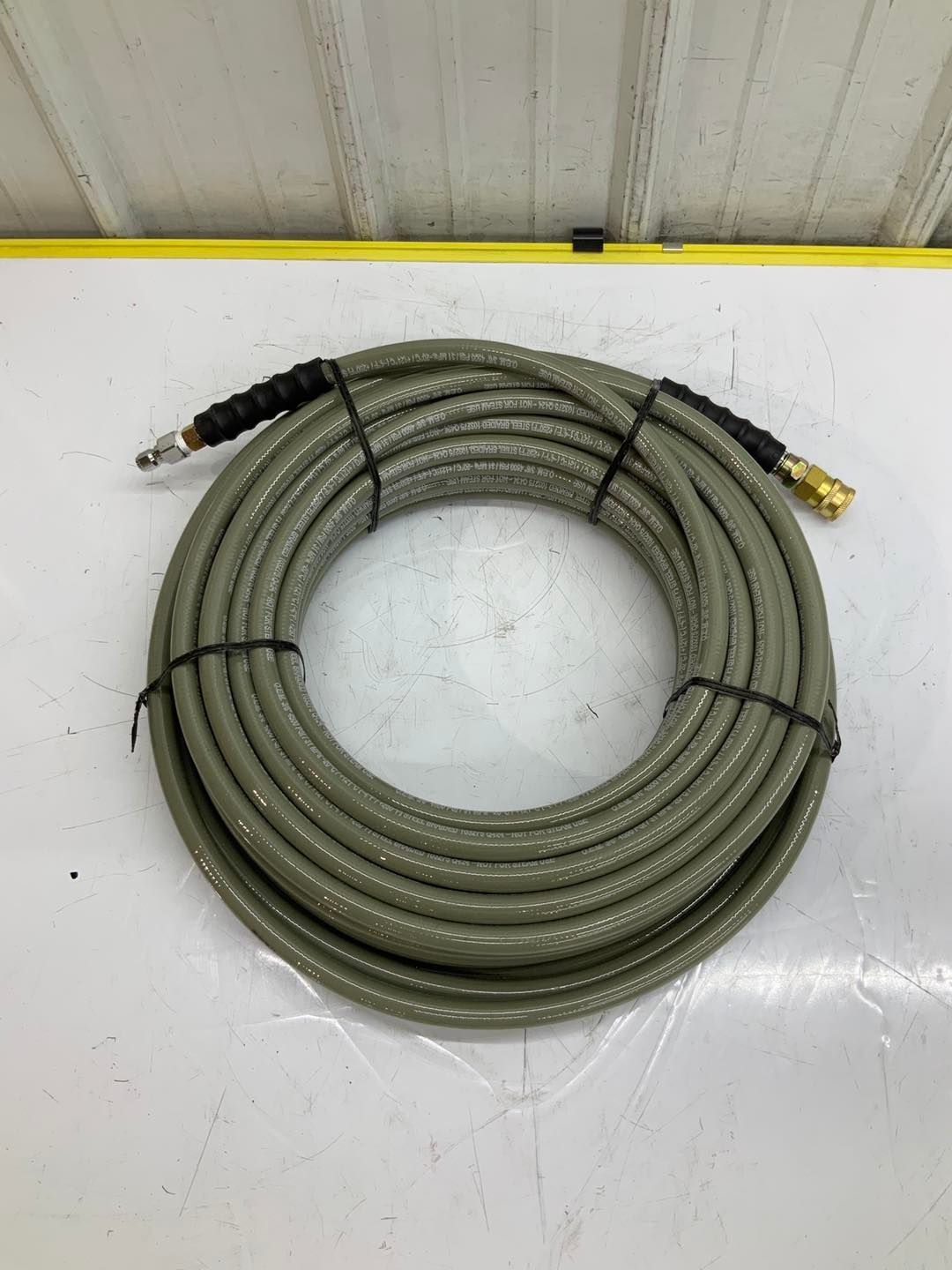 A hose is sitting on top of a white table.