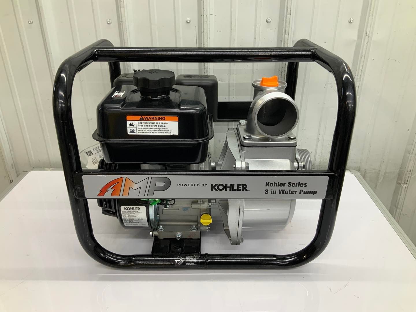 A kohler water pump is sitting on top of a white table.