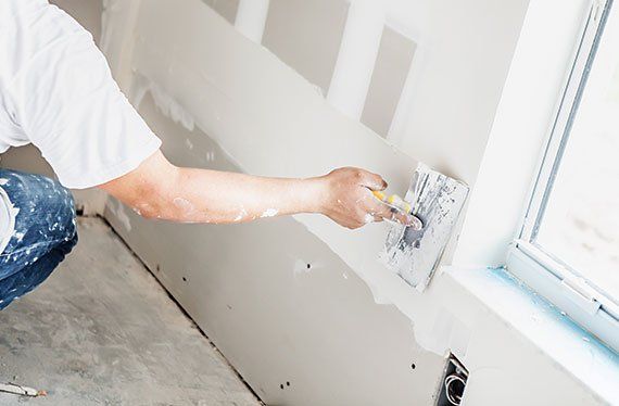 Man Spackling New Drywall — Olympia, WA — Puget Painting & Home Repair LLC