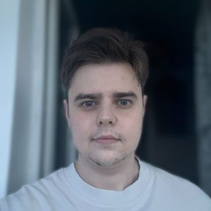 A young man is looking at the camera in a circle.