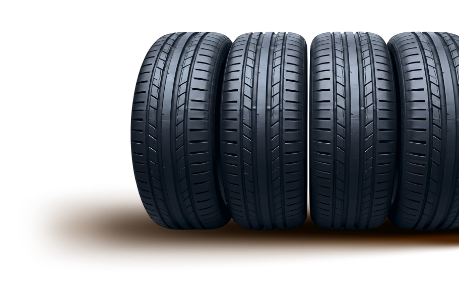 Three black car tires stacked horizontally on a white background | Sam Smith Performance Car Care Center