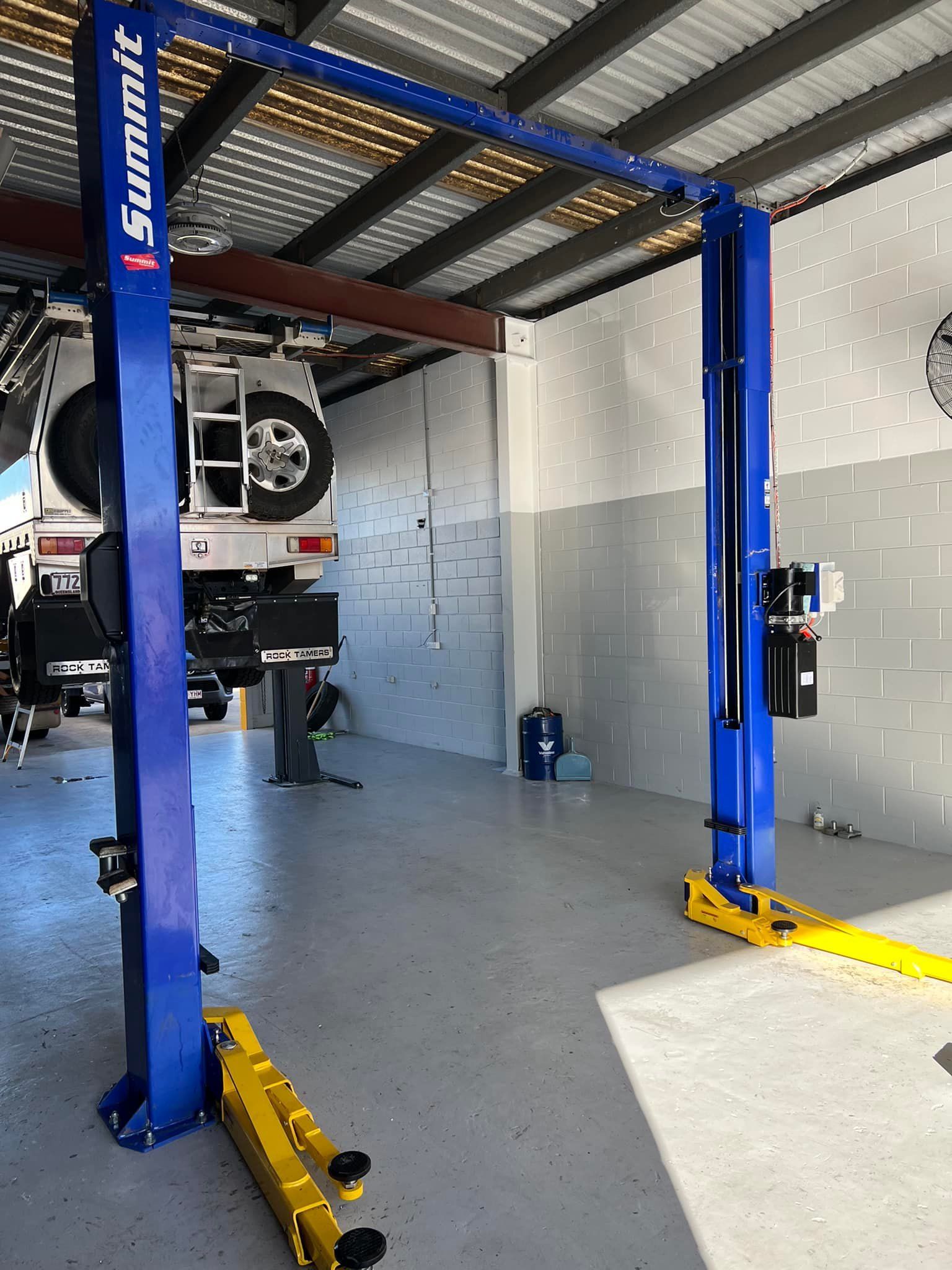 A Red Car Is Parked In A Garage With Its Hood Open — Murphys Mobile Mechanical In Rockhampton, QLD