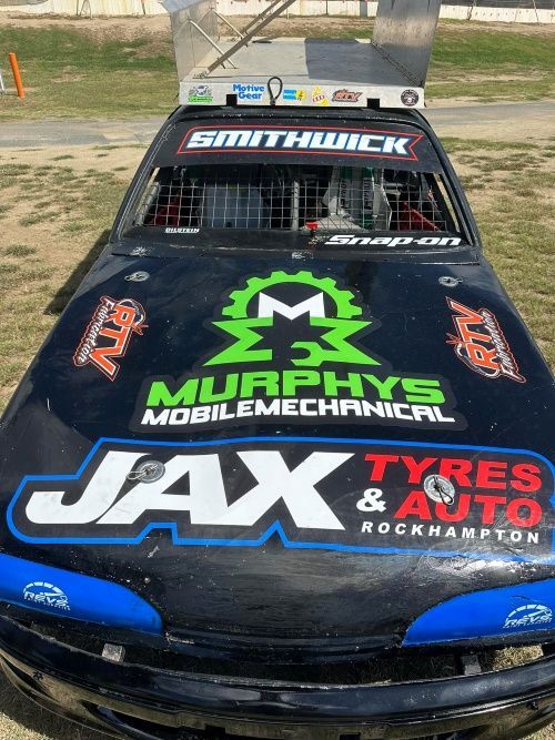 A Race Car With Murphys Mobile Mechanical Jax Tyres And Auto Written On It — Murphys Mobile Mechanical In Rockhampton, QLD