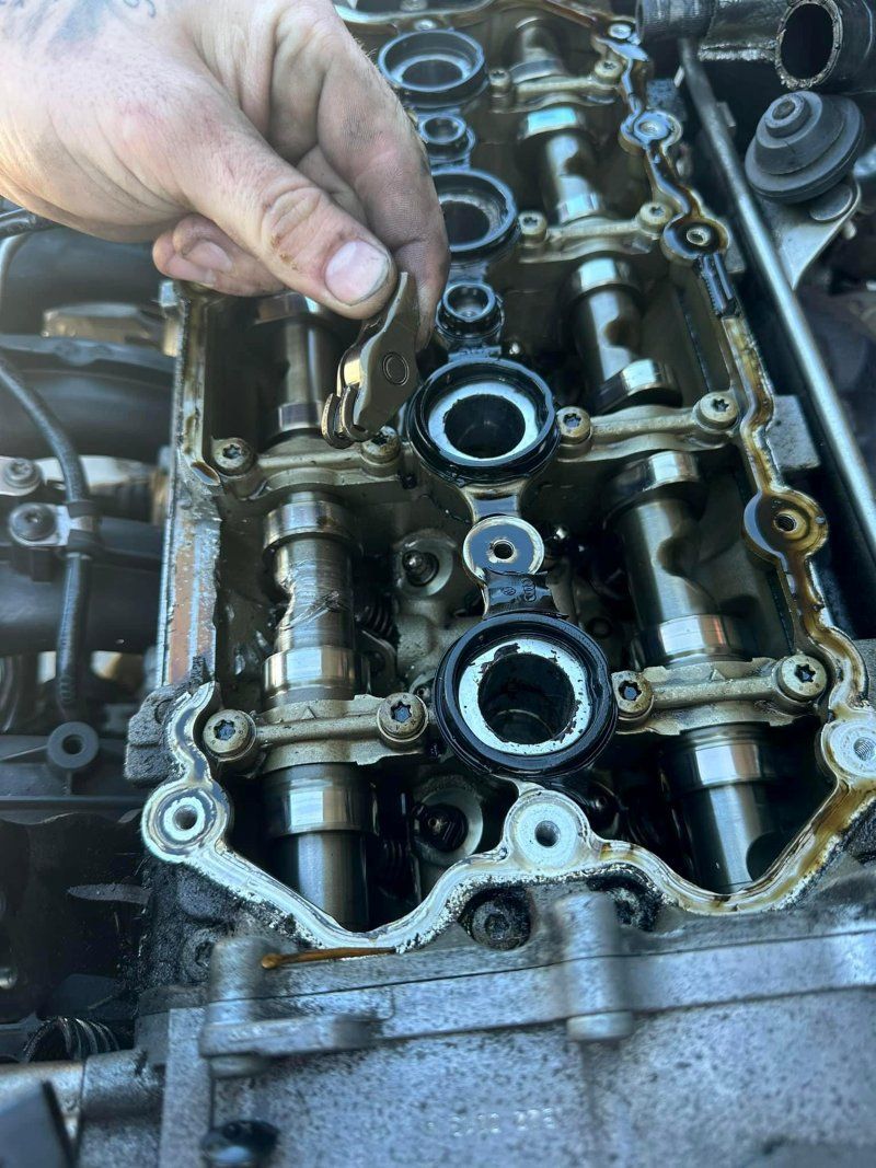 A Person Is Working On A Car Engine With A Wrench — Murphys Mobile Mechanical In Rockhampton, QLD