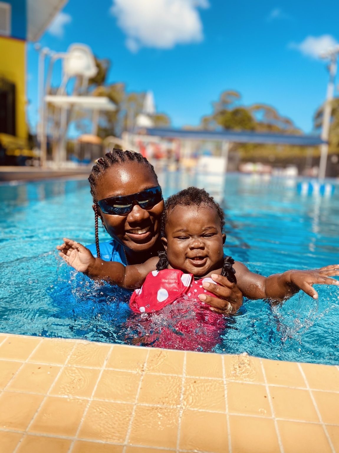 Happy Coach Pat and Little Baby — Sunrise, FL — Pat's Swimming Academy