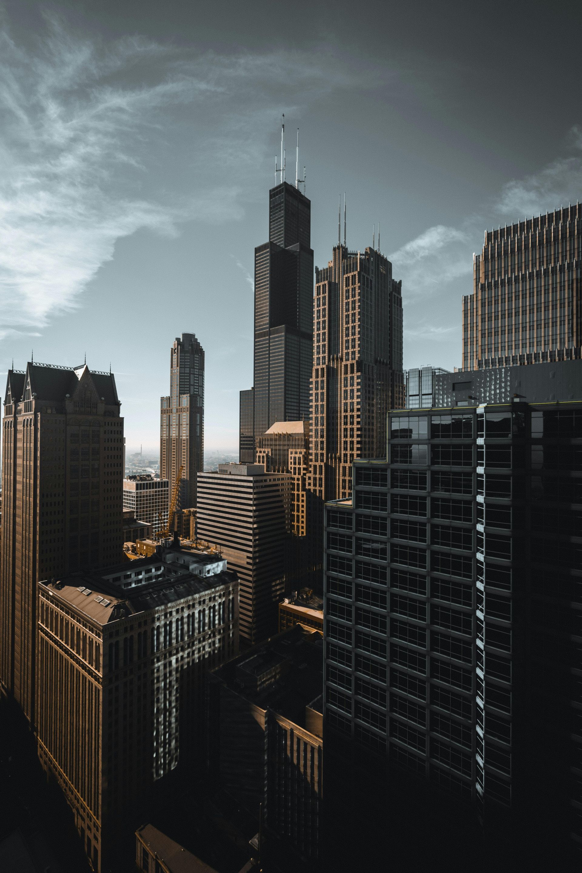 An aerial view of a city skyline with a lot of tall buildings