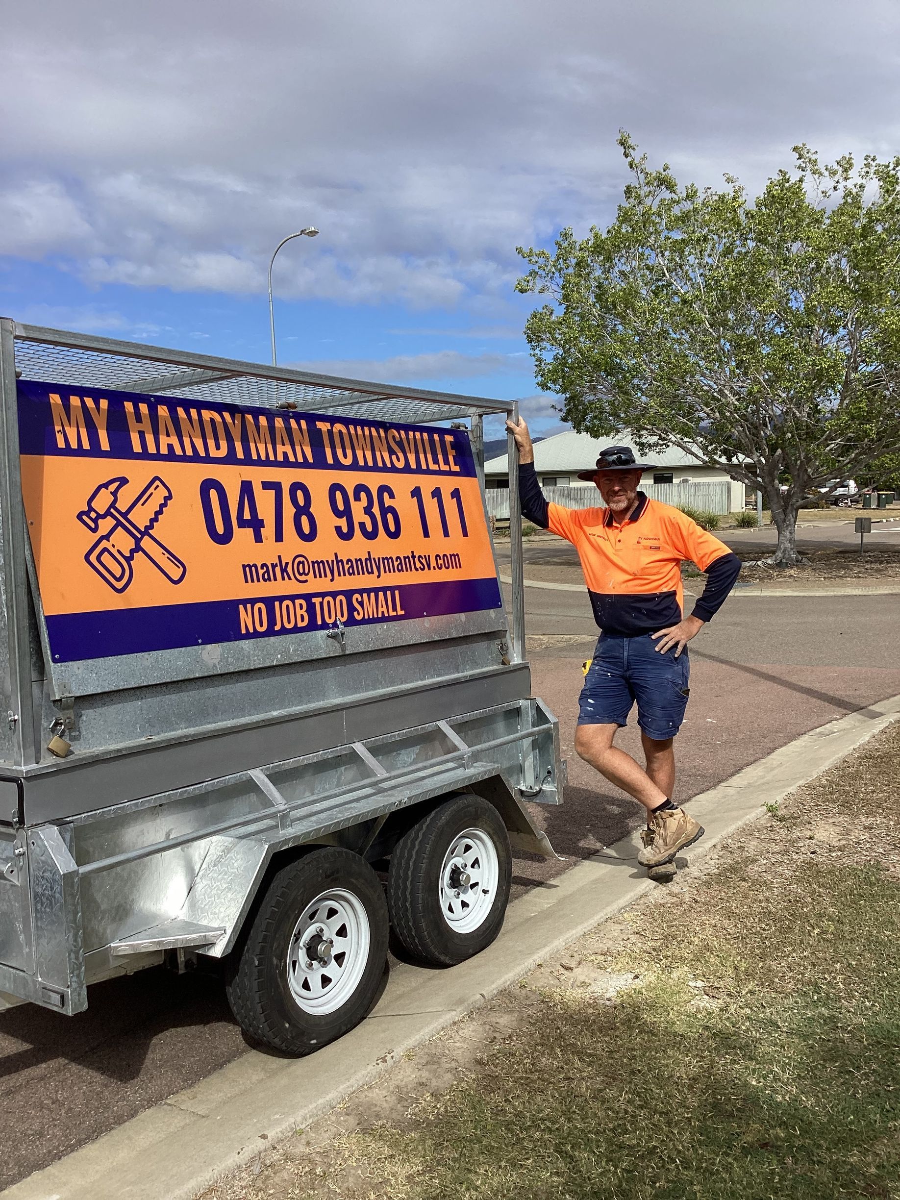 Handyman standing next to his vehicle — Handyman Services in Belgian Gardens, QLD