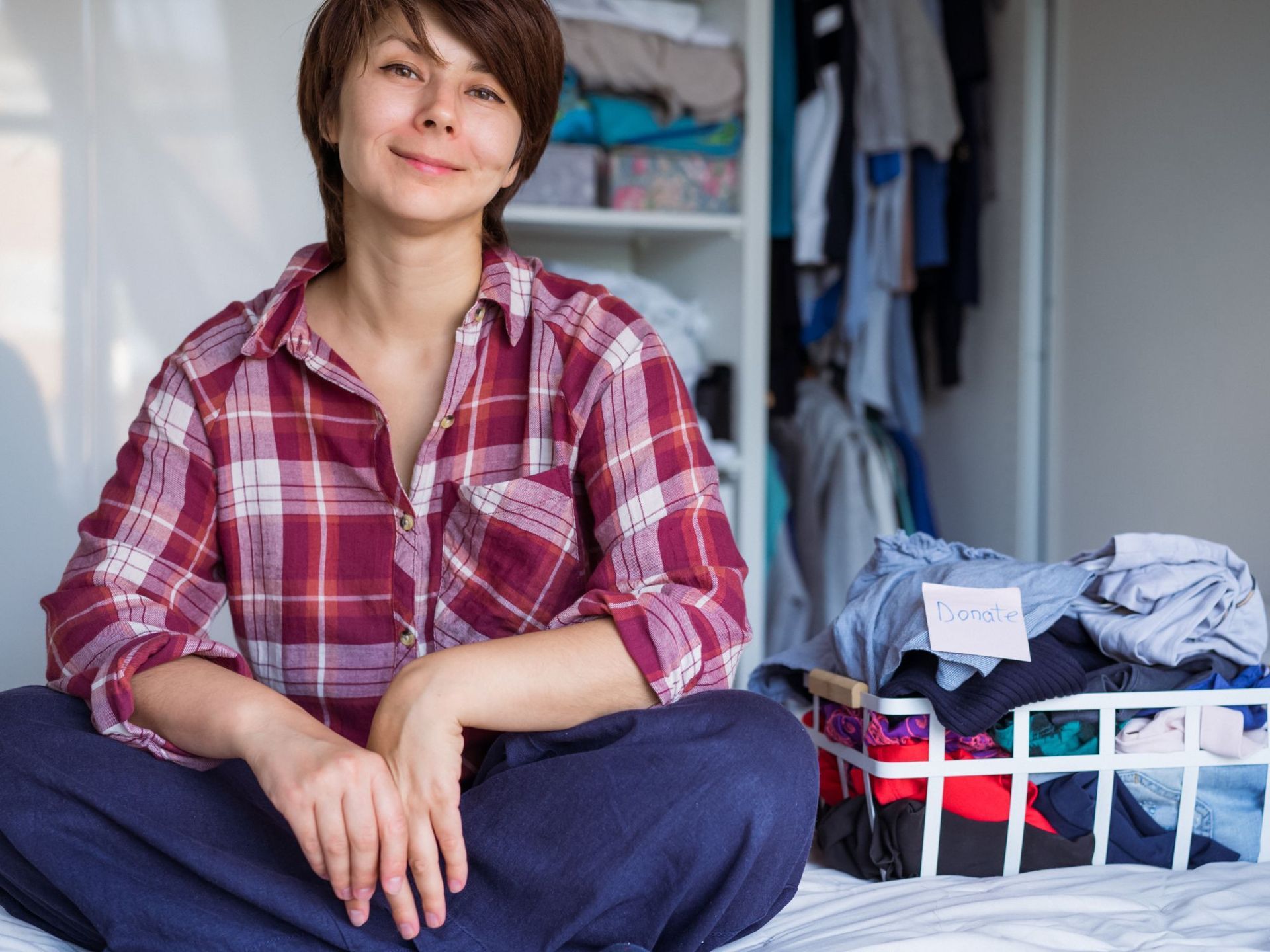 Woman happy after sorting possessions