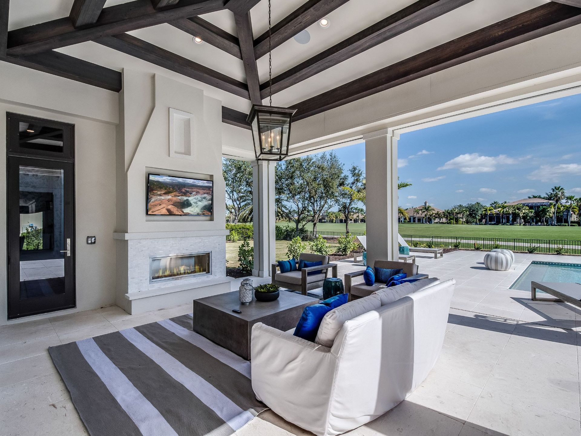 Clean organized patio by a pool