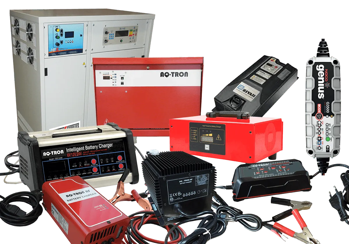 A Variety of Battery Chargers Are Sitting on Top of Each Other on a Table — Central Coast Batteries In Long Jetty, NSW