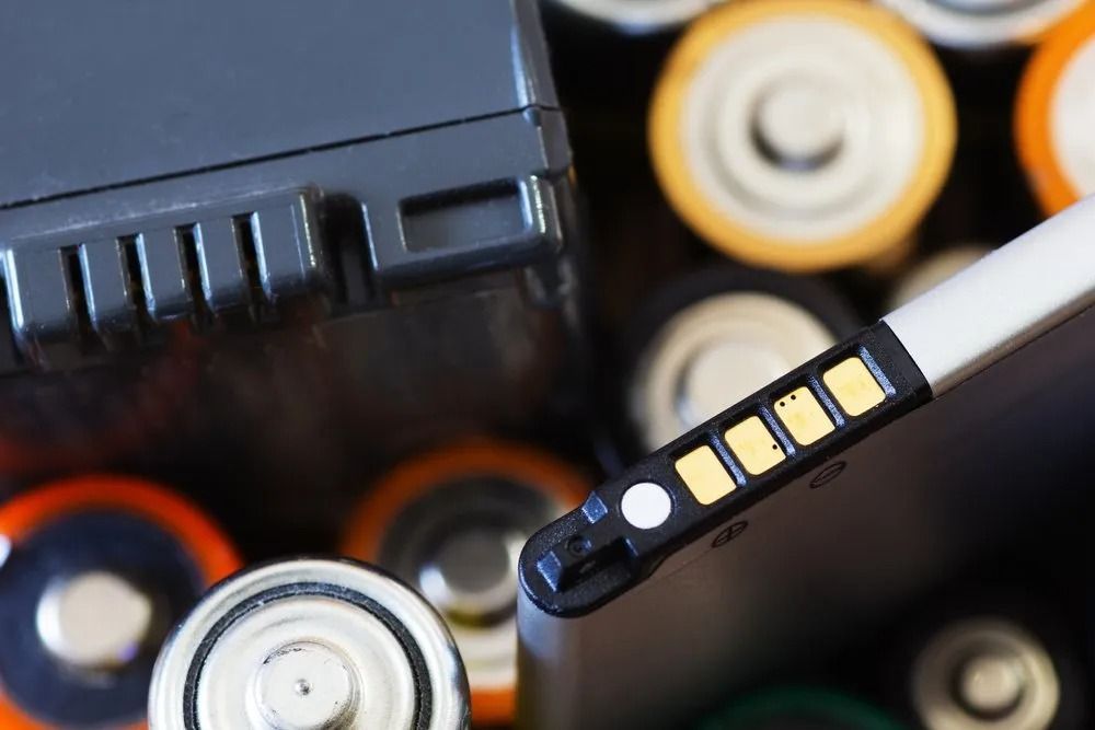 A Pile of Batteries Including a Cell Phone Battery — Central Coast Batteries In Long Jetty, NSW
