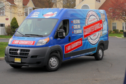 A blue van with the word plumbing on it