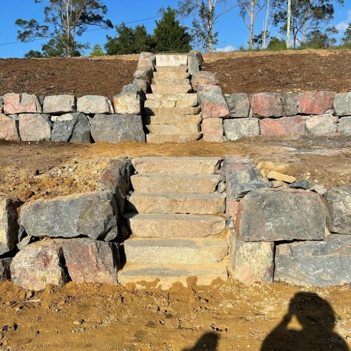 A Stone Wall with Stairs Leading up To It — Webster Rock Walls In Ilkley, QLD