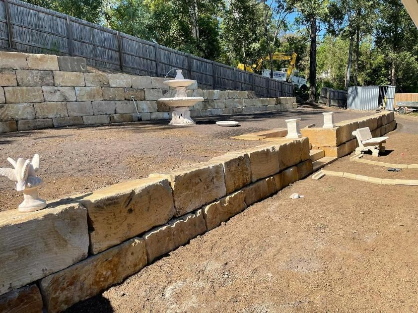 A Stone Wall with A Fountain in The Middle of It — Webster Rock Walls In Gympie, QLD