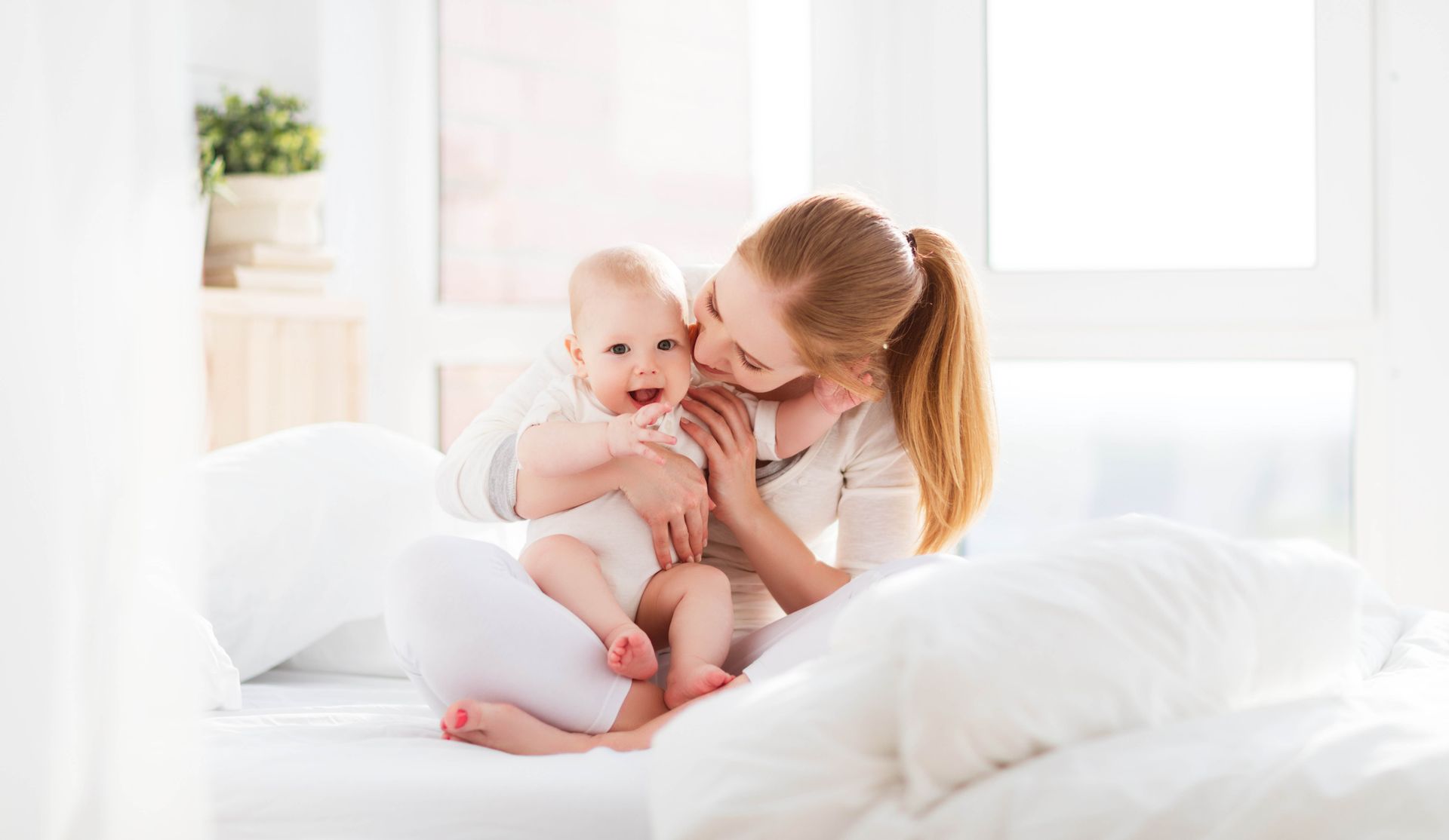 A mother with her new baby, experiencing Tongue Tie. Explore our Blog to answer all your questions.
