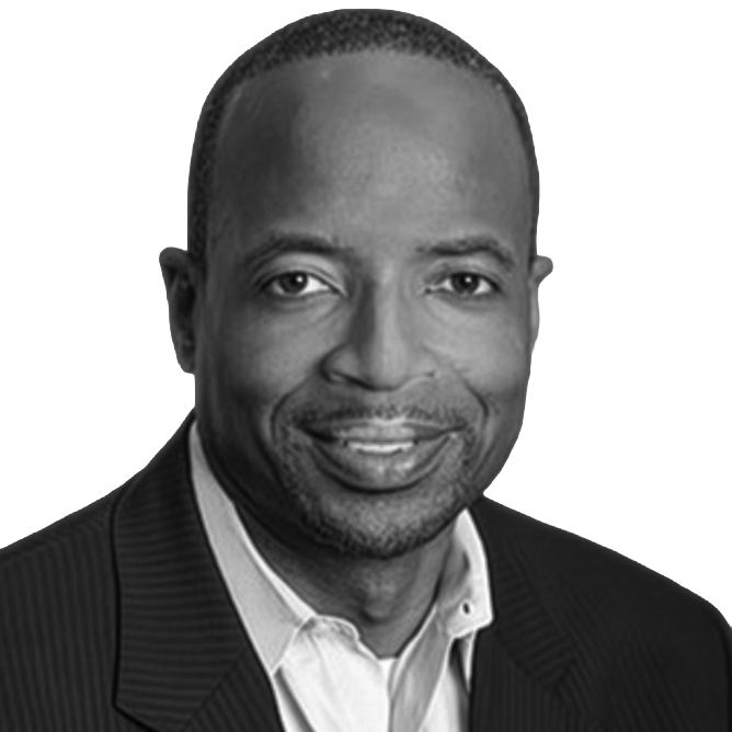 Smiling man in a suit jacket, headshot.