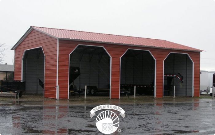 A red metal building with a white trim and a red roof