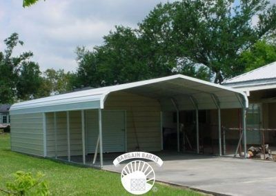 A white carport is sitting in front of a house