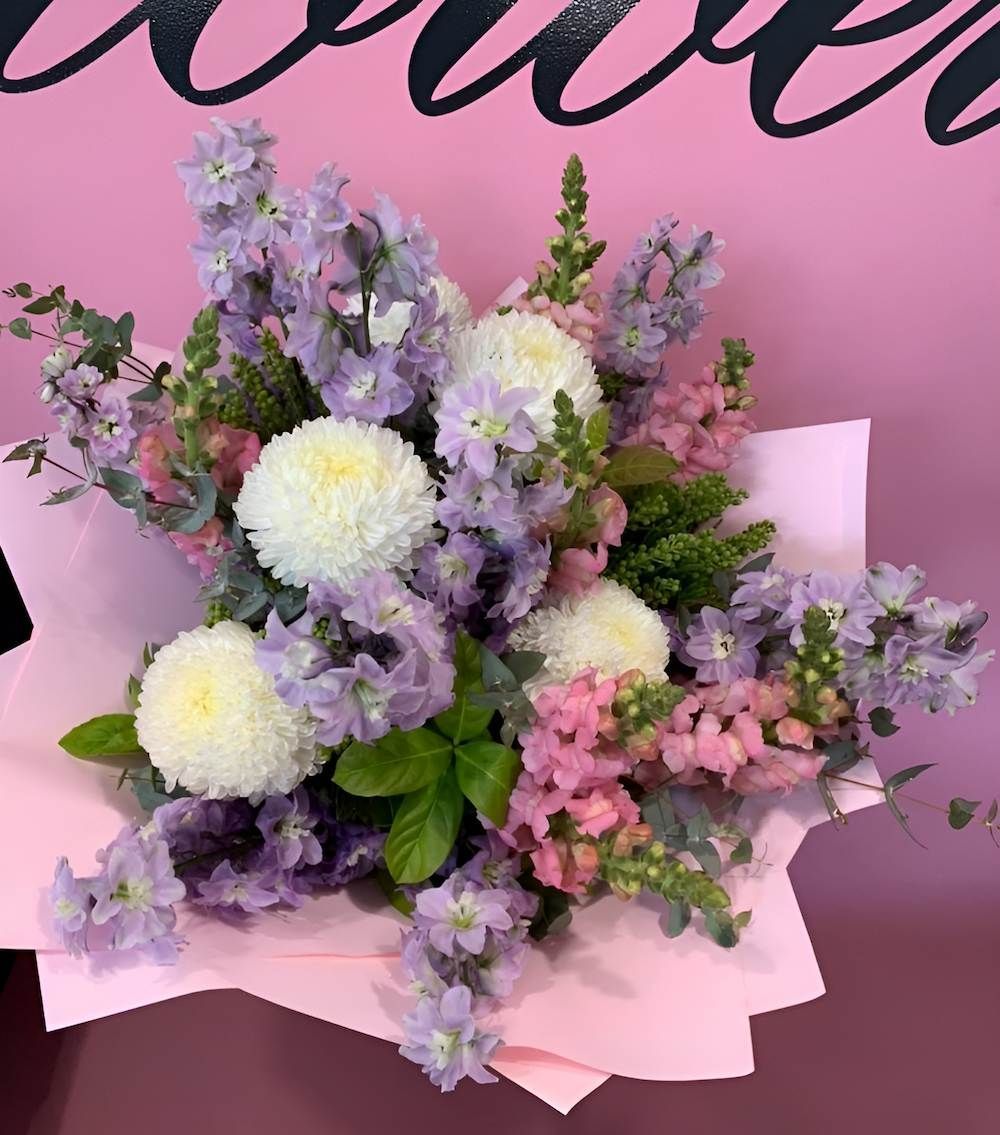 A Bouquet of Purple and Pink Flowers on a Pink Background — Bundaberg House of Flowers In Bargara, QLD
