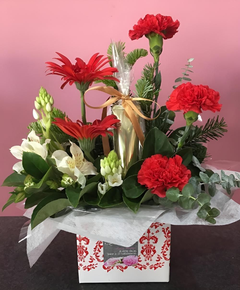 A Bouquet of Red and White Flowers in a Box — Bundaberg House of Flowers In Coral Cove, QLD