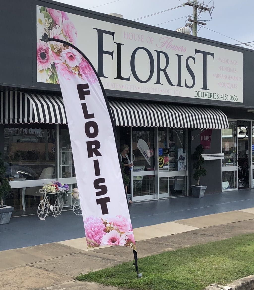A Florist Shop with A Flag in Front of It — Bundaberg House of Flowers in Bundaberg West, QLD