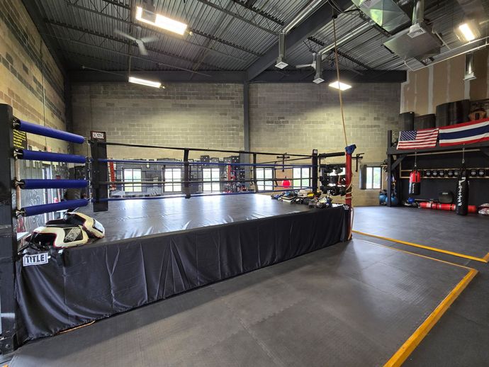 Muay Thai trainer Amr Ibrahim giving striking instruction in the gym