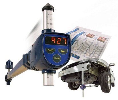 Car alignment tool displaying a digital reading, alongside a car being repaired and a diagram.