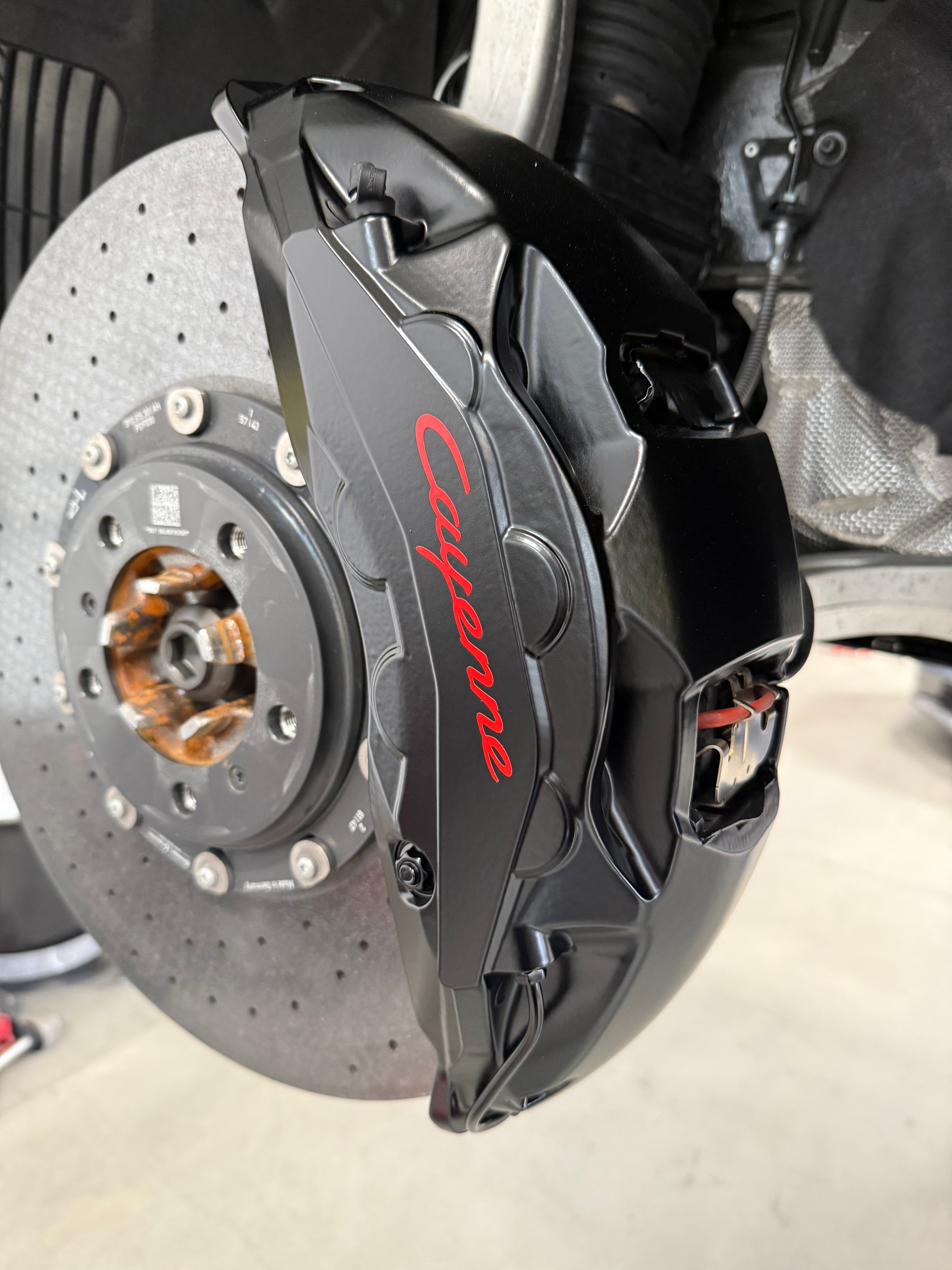 A close up of a porsche brake disc