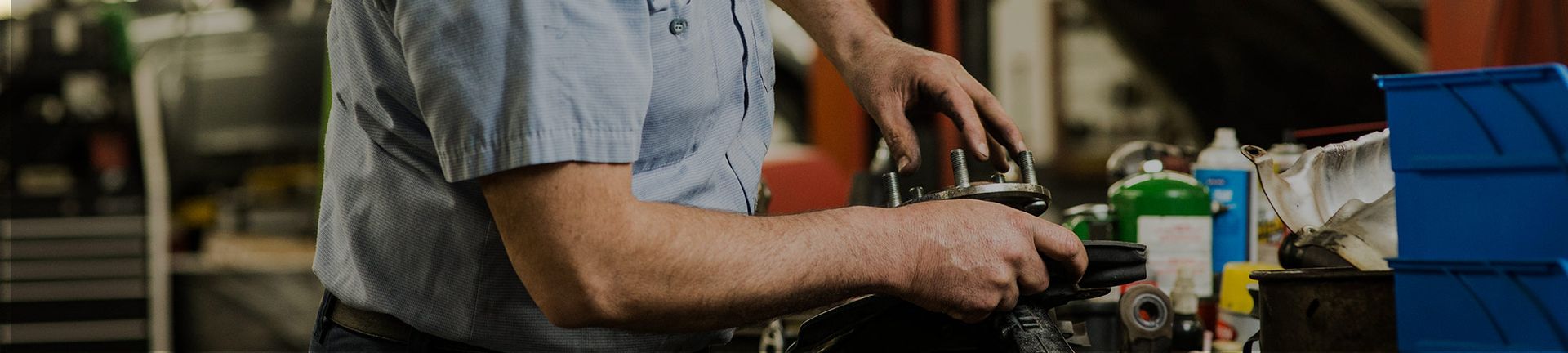 Mechanic Working on a Car Engine | Acute Auto Care LLC