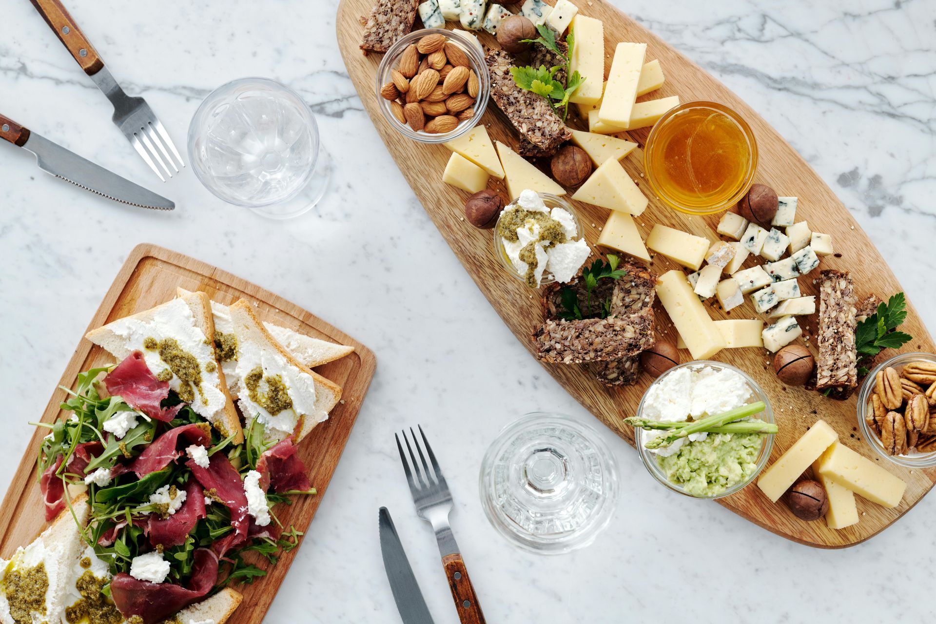 A wooden cutting board with a variety of food on it.