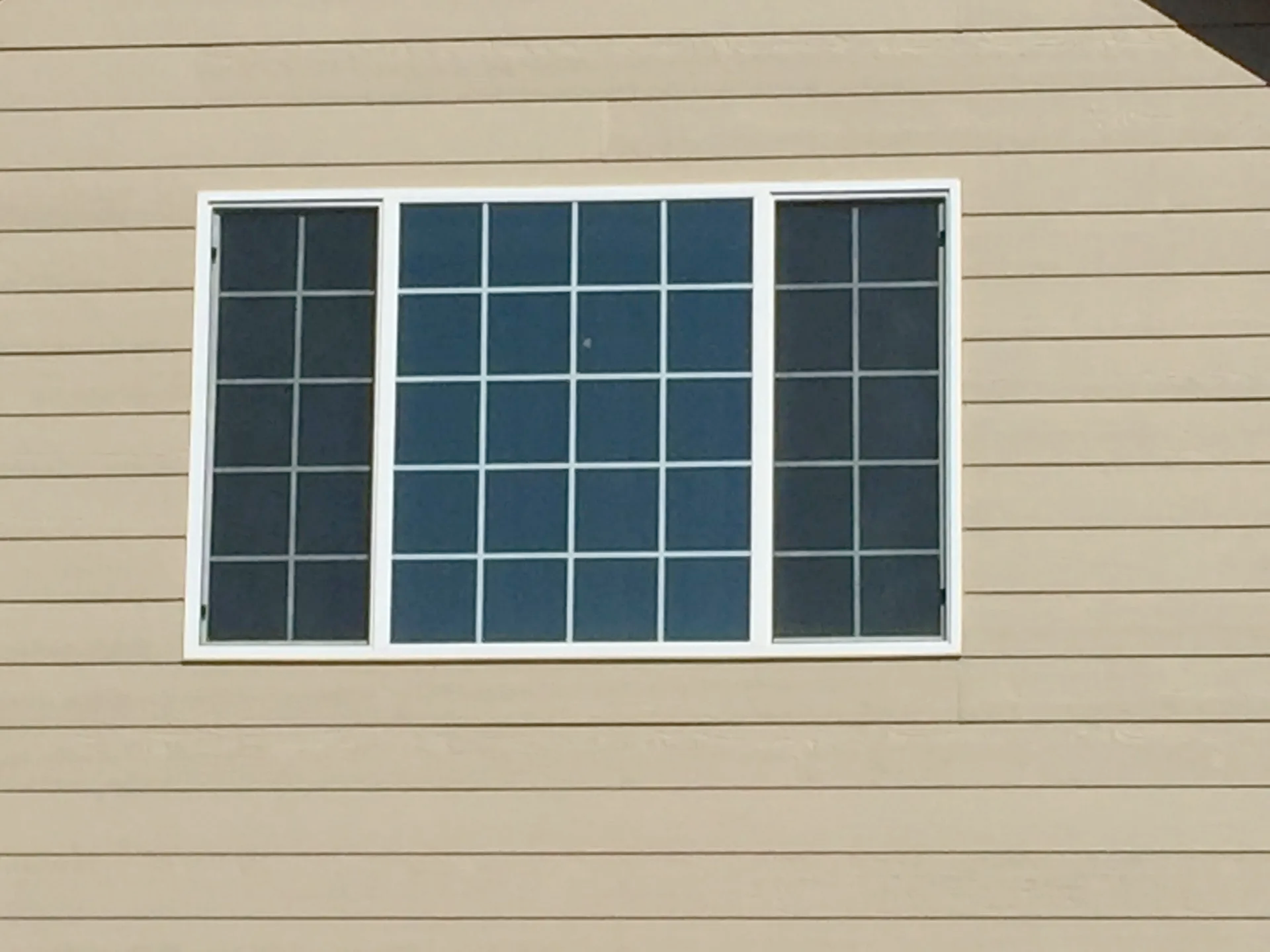 A large window on the side of a house