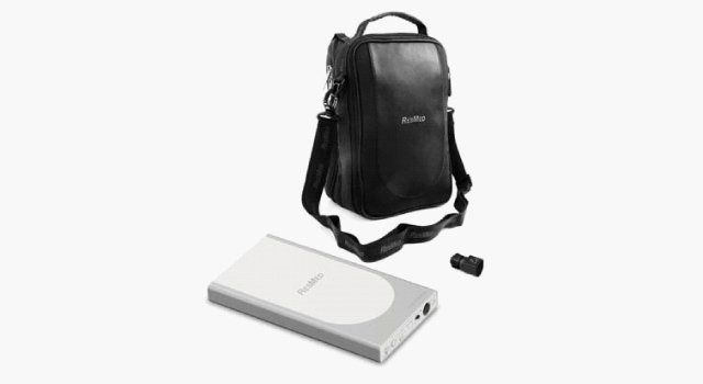 Silver and white portable hard drive, black carrying case with handle, and black plug adapter on white background.
