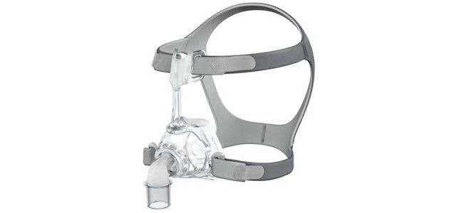 CPAP mask with gray frame and clear face covering, white background.