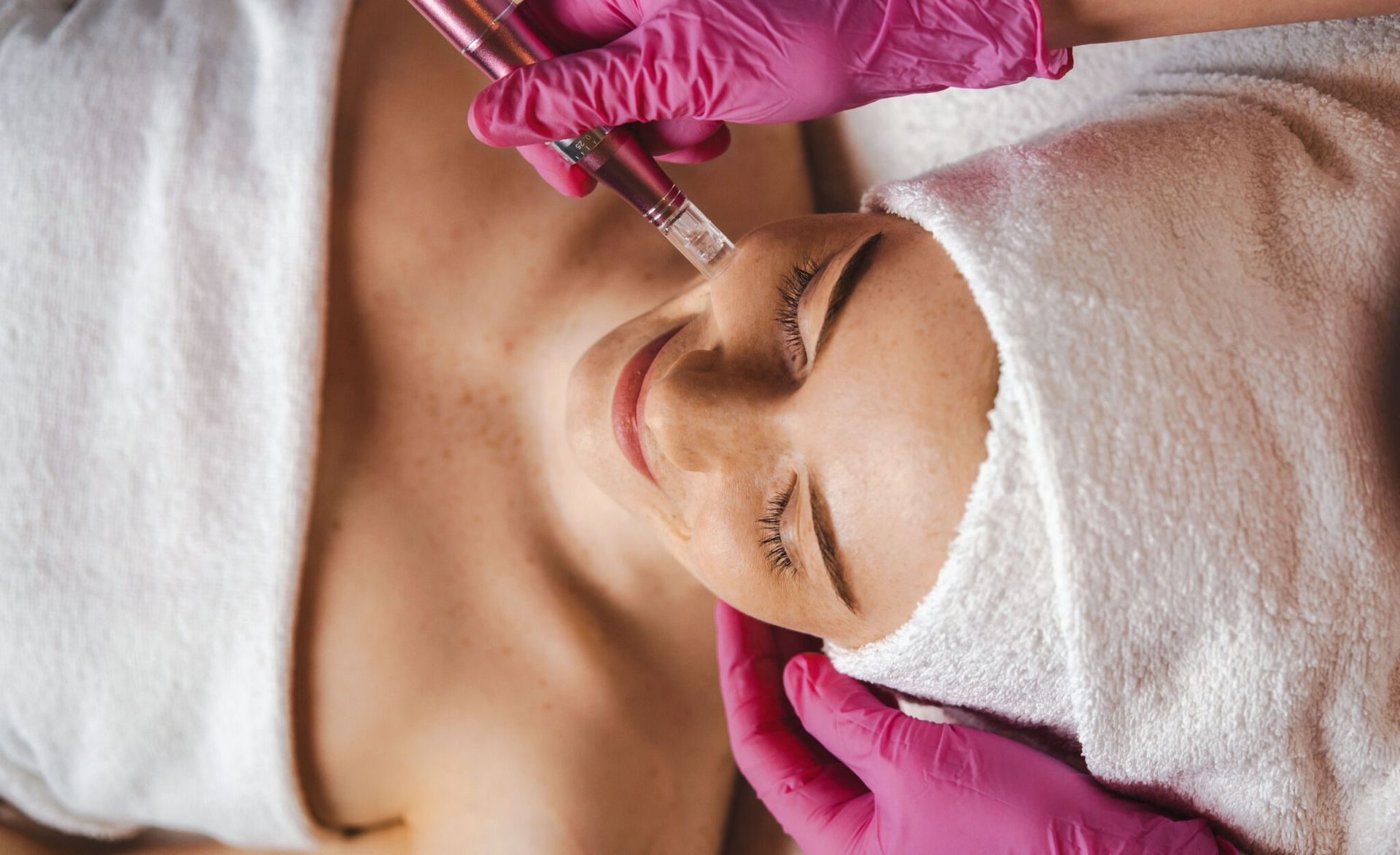A woman is getting a facial treatment at a spa.