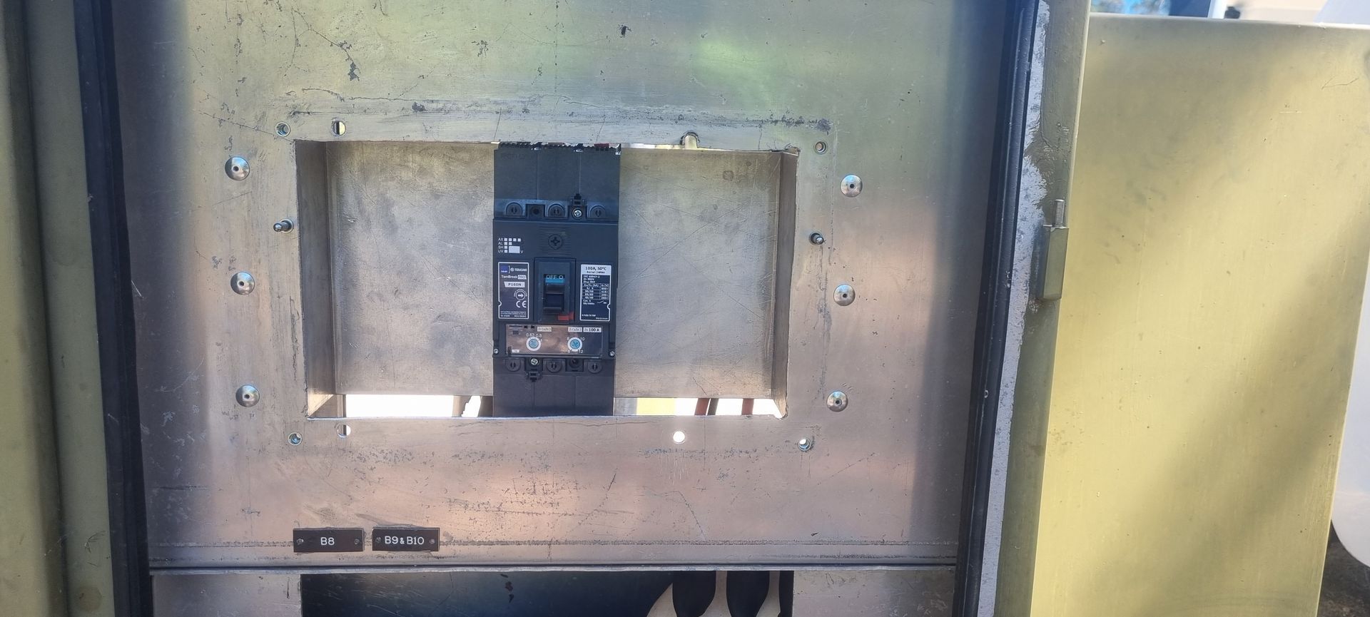 A close up of a metal box with a breaker in it.