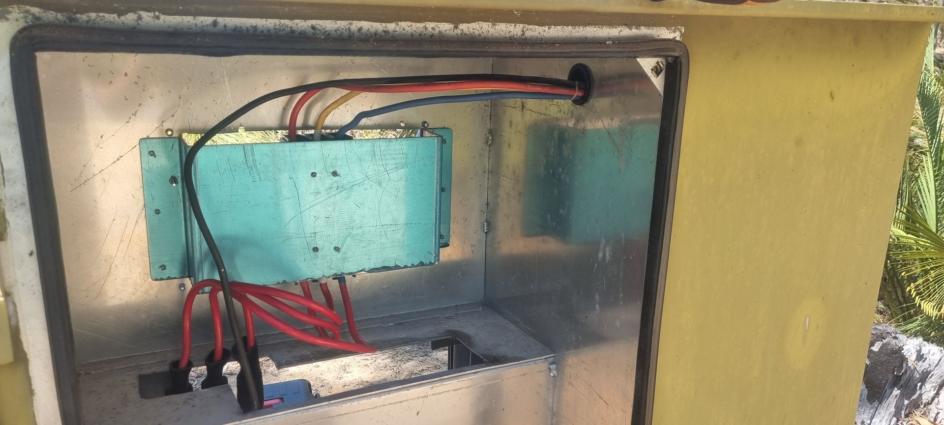 A box with a bunch of wires coming out of it.