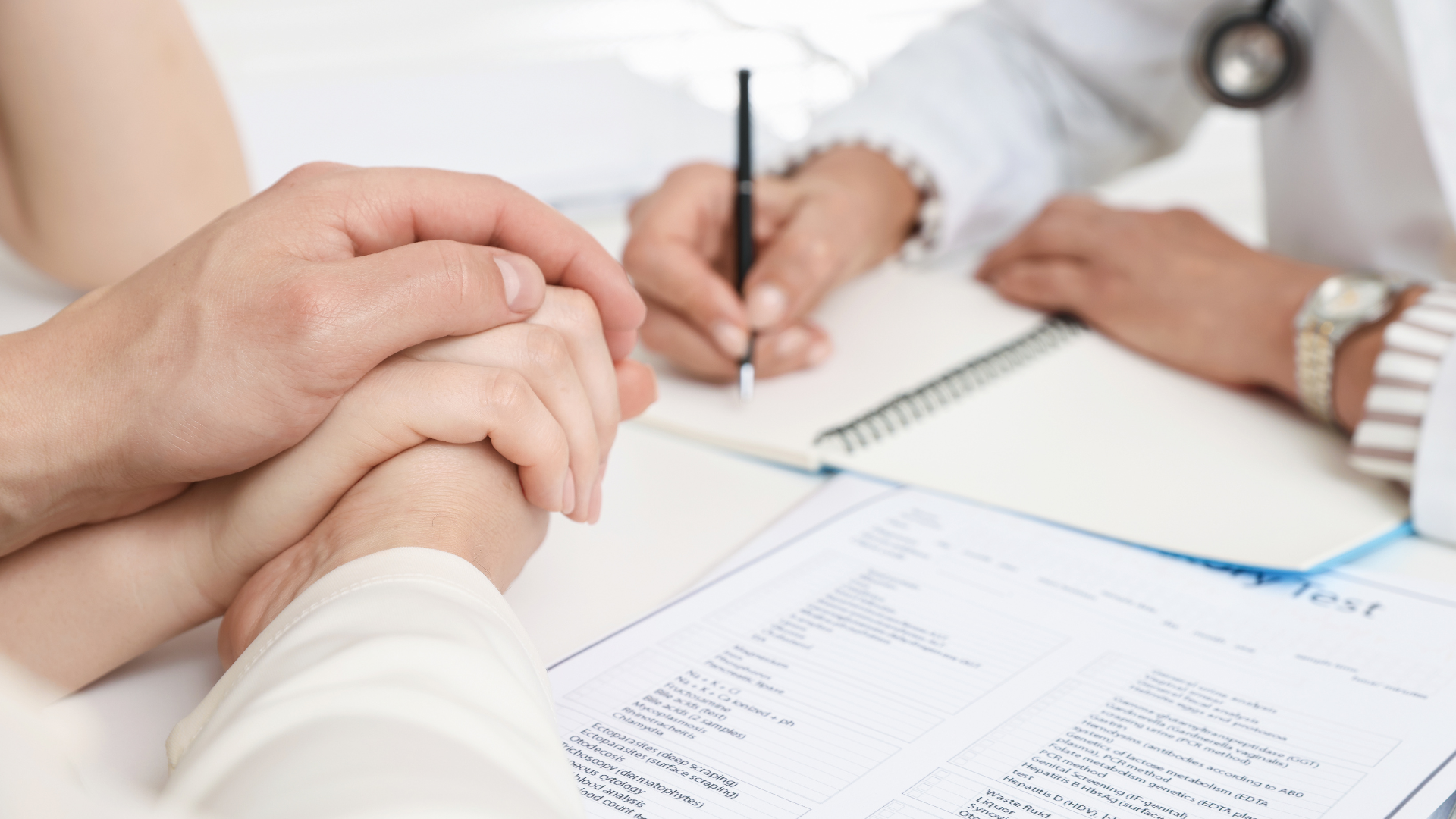 Colorful vegetable and quinoa bowl with broccoli, carrots, peppers, Brussels sprouts, and herbs on a white plate.