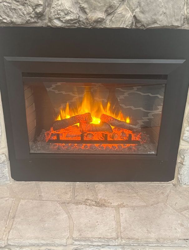 Stone surround electric fireplace with efficient heating and realistic flame.