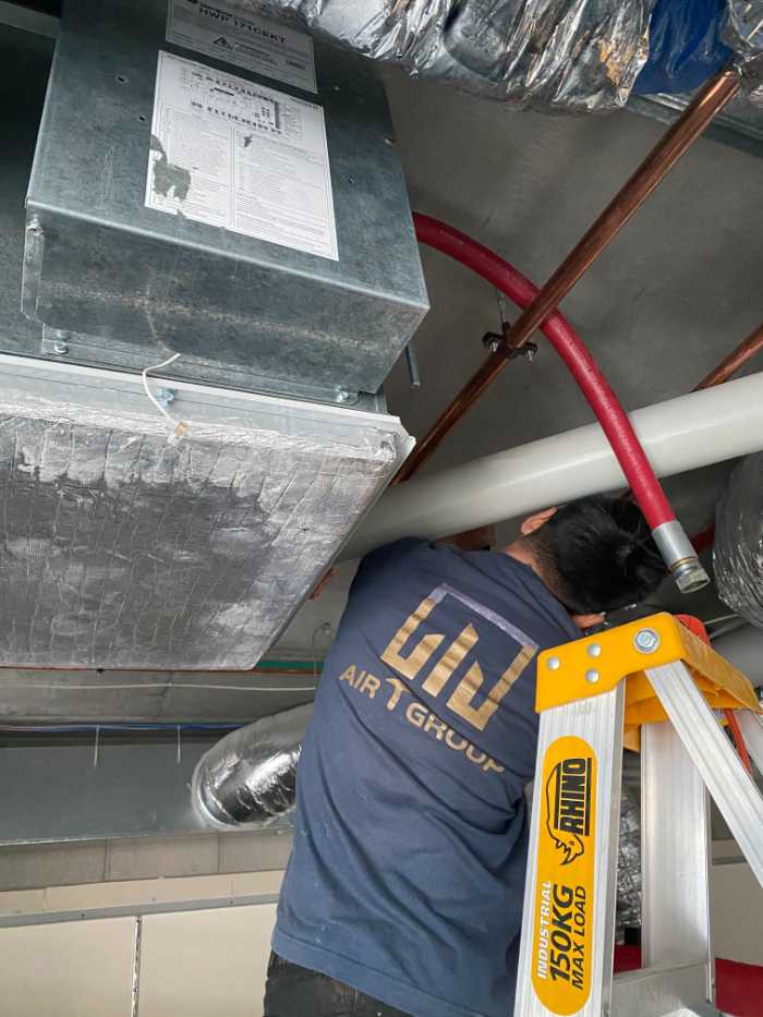 man installing pipes