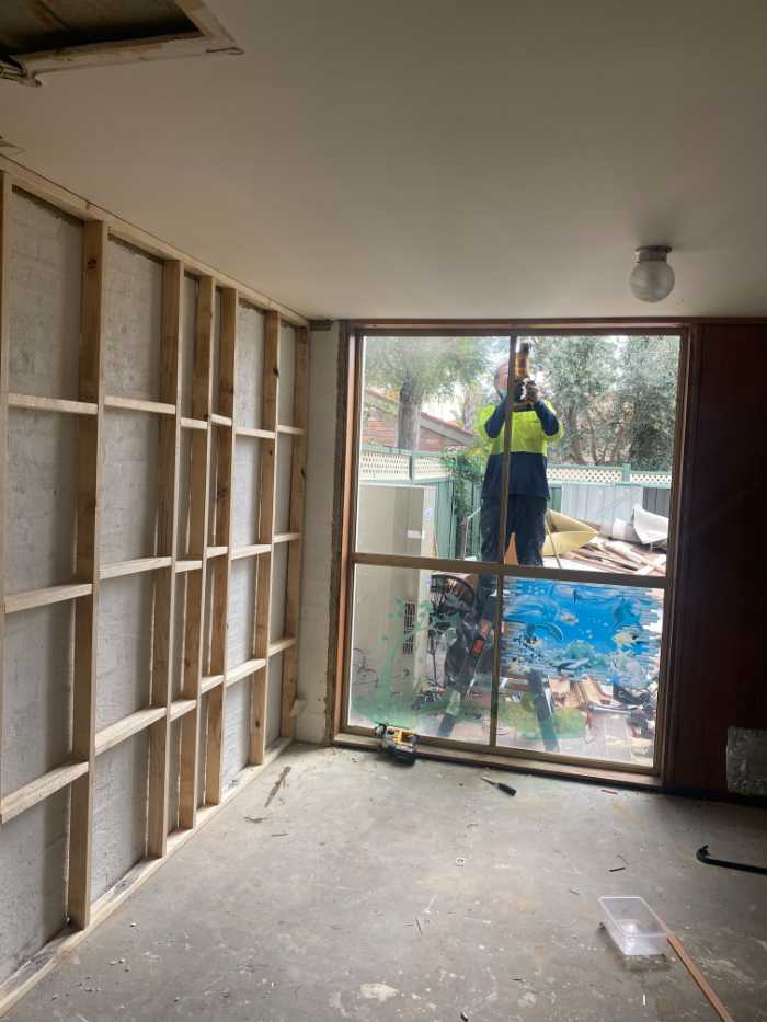 man installing mirrors