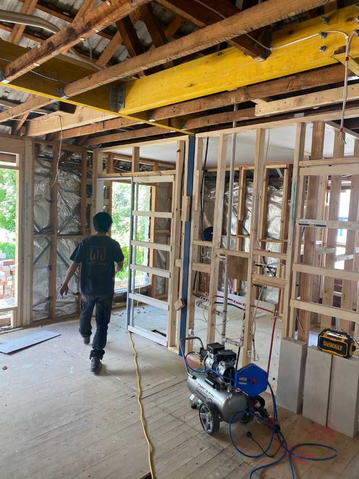 man walking through a room