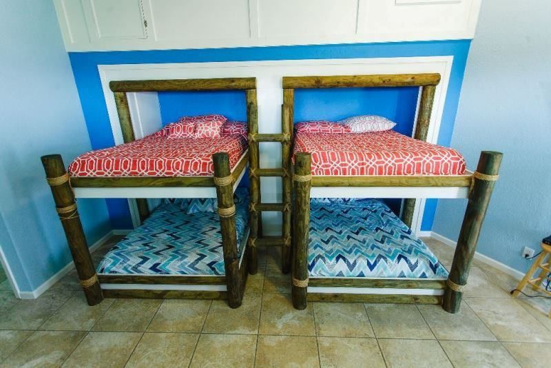 Two bunk beds are sitting next to each other in a room.