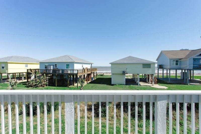 A view of a row of houses from a balcony.