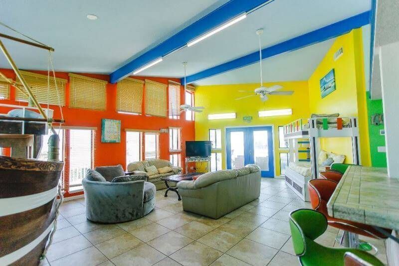 A living room with a boat in the middle of it