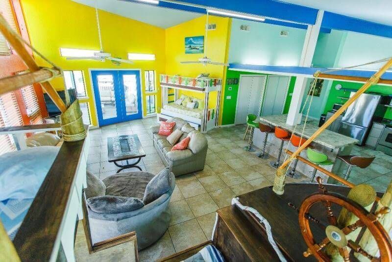 A living room with a steering wheel in the middle of it