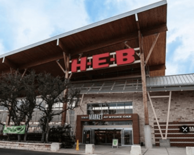 A heb grocery store with a wooden roof